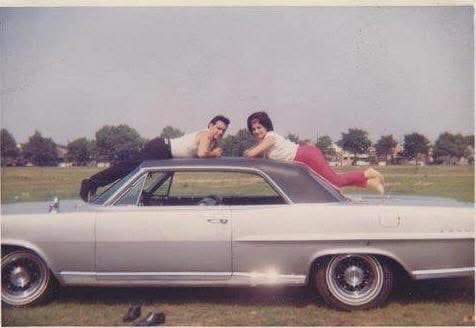 Her mother and father, on the car